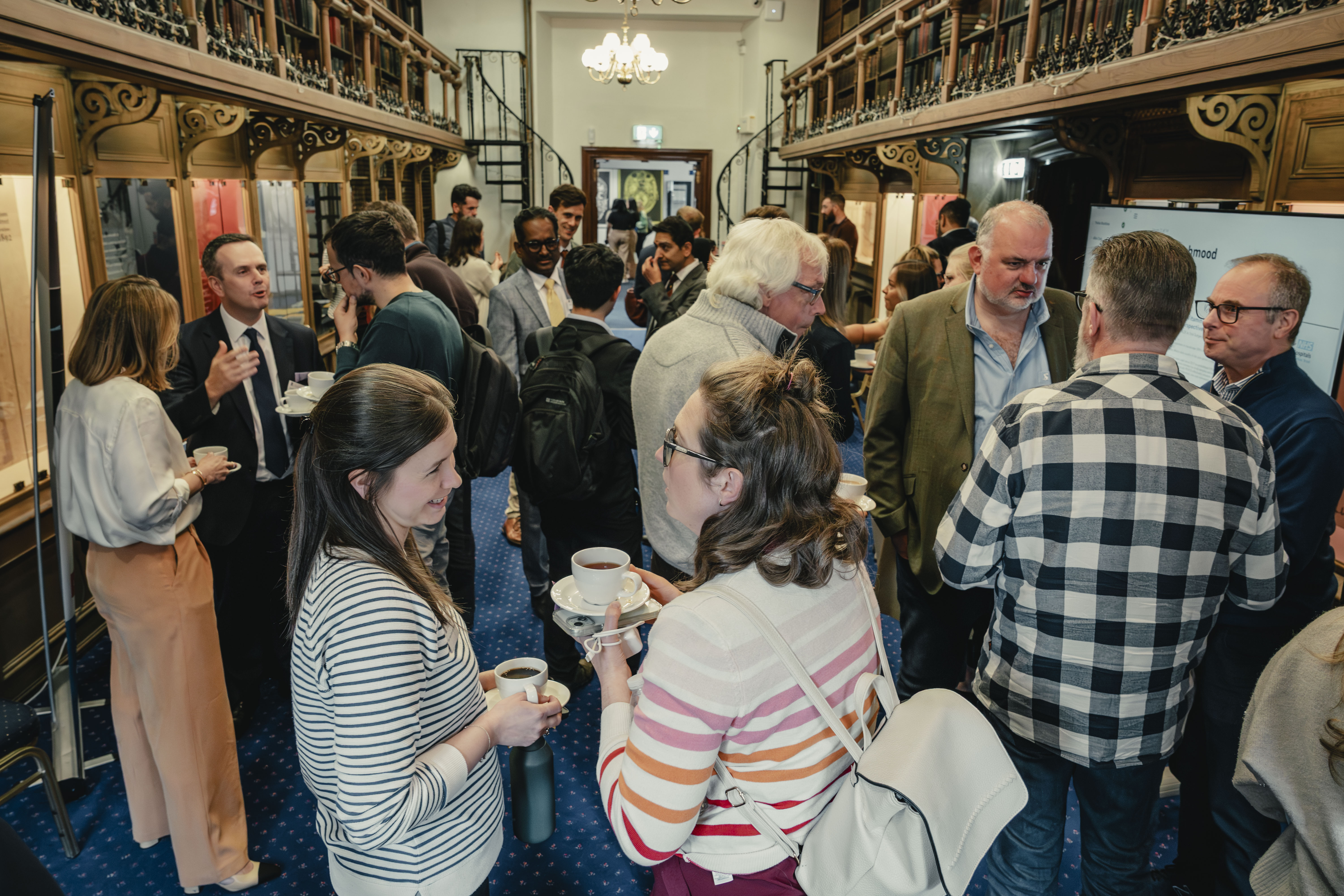 a large group socialising at a conference